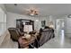 Spacious living room with a ceiling fan, hardwood floors, and a view into the hallway at 4230 Braden Nw Ln, Kennesaw, GA 30144