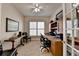 Well-lit office with a desk setup and shelving; perfect for working from home at 4230 Braden Nw Ln, Kennesaw, GA 30144