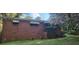 A charming brick home exterior features a blossoming tree in its front yard at 102 Welch St, Stockbridge, GA 30281