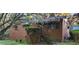 Charming brick home exterior with blossoming tree in the front yard at 102 Welch St, Stockbridge, GA 30281