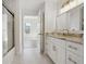 Bathroom featuring a modern vanity, granite countertops, and a glass shower enclosure at 1101 Juniper Ne St # 1511, Atlanta, GA 30309