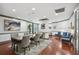 Bright dining room with hardwood floors, modern art, seating for eight, and lots of natural light at 1101 Juniper Ne St # 1511, Atlanta, GA 30309