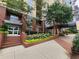 Inviting building entrance with well-maintained landscaping and brick walkway at 1101 Juniper Ne St # 1511, Atlanta, GA 30309