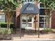 Close up of the building's front doors beneath a large awning with the building number at 1101 Juniper Ne St # 1511, Atlanta, GA 30309
