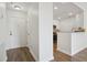Bright entryway featuring wood floors, white walls, and a partial view into the kitchen at 1101 Juniper Ne St # 1511, Atlanta, GA 30309