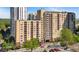 Building exterior featuring mature trees and many balconies with sliding doors at 1101 Juniper Ne St # 1511, Atlanta, GA 30309