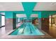 Long indoor swimming pool featuring overhead lighting, and windows at 1101 Juniper Ne St # 1511, Atlanta, GA 30309