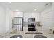 Bright kitchen featuring stainless appliances, stone countertops, tile backsplash and white cabinets at 1101 Juniper Ne St # 1511, Atlanta, GA 30309