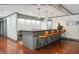 Stylish kitchen with modern lighting, sleek counter, and stainless steel oven and barstool seating at 1101 Juniper Ne St # 1511, Atlanta, GA 30309