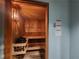 Inviting wood sauna featuring multi-tiered seating and a wall-mounted light for a relaxing spa-like experience at 1101 Juniper Ne St # 1511, Atlanta, GA 30309