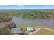 Aerial view of property featuring lake access, tennis courts, and a swimming pool at 2450 Weber Heights Way, Buford, GA 30519