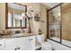 Bathroom features a glass door shower and granite countertops, offering a relaxing space at 2450 Weber Heights Way, Buford, GA 30519