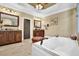 Luxurious bathroom features jacuzzi tub, separate vanities, and elegant lighting fixtures at 2450 Weber Heights Way, Buford, GA 30519