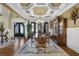 Elegant dining room with hardwood floors, chandelier, and sophisticated decor at 2450 Weber Heights Way, Buford, GA 30519
