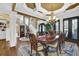 Formal dining room with chandelier, staircase, and elegant furnishings at 2450 Weber Heights Way, Buford, GA 30519