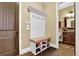 Functional entryway featuring a bench with storage, hooks, and shoe racks at 2450 Weber Heights Way, Buford, GA 30519
