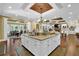 Spacious kitchen with a large island, granite countertops, and wood floors and ceiling at 2450 Weber Heights Way, Buford, GA 30519