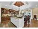 An open kitchen with a large island, granite countertops, and stainless steel appliances at 2450 Weber Heights Way, Buford, GA 30519