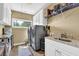 Well-equipped laundry room with modern washer and dryer, ample counter space, and storage cabinets at 2450 Weber Heights Way, Buford, GA 30519