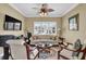Comfortable living room featuring a sofa, armchairs, and a large window with plantation shutters at 2450 Weber Heights Way, Buford, GA 30519