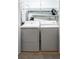 Functional laundry room featuring side by side washer and dryer units and overhead wire shelving at 264 19Th Nw St # 2308, Atlanta, GA 30363
