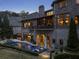 Beautiful backyard oasis featuring a pool with lounge chairs and a covered patio at 290 Ardsley Ln, Alpharetta, GA 30005