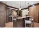 Kitchen wet bar area with marble counters, custom cabinetry, overhead lighting and stainless steel sink at 290 Ardsley Ln, Alpharetta, GA 30005