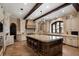 Gourmet kitchen features a large island, custom cabinetry, and high-end appliances, perfect for cooking and entertaining at 290 Ardsley Ln, Alpharetta, GA 30005
