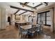 Spacious kitchen and dining area with a large island, custom cabinets, and an abundance of natural light from the large window at 290 Ardsley Ln, Alpharetta, GA 30005