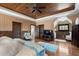 Well-lit primary bedroom with wood ceiling, hardwood floors, and multiple closets at 290 Ardsley Ln, Alpharetta, GA 30005