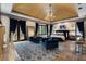 Large main bedroom with a trey ceiling, chandelier, sitting area, and private outdoor access at 290 Ardsley Ln, Alpharetta, GA 30005