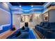 Home theater room featuring a starlit ceiling, custom lighting, comfortable seating, and movie posters at 290 Ardsley Ln, Alpharetta, GA 30005