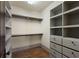 Spacious walk-in closet with custom shelving and ample storage space at 290 Ardsley Ln, Alpharetta, GA 30005
