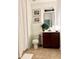 Cozy bathroom with neutral colored tile, single vanity, toilet, and shower behind a curtain at 4836 Se Merriman Se Walk # 23, Smyrna, GA 30080