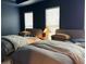 Bedroom featuring two twin beds, each with padded headboards and large windows at 4836 Se Merriman Se Walk # 23, Smyrna, GA 30080