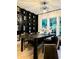 Spacious dining room with wood floors, a large dining table, and stylish wine rack at 4836 Se Merriman Se Walk # 23, Smyrna, GA 30080