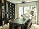 Elegant dining room with wine rack, large table, and modern lighting at 4836 Se Merriman Se Walk # 23, Smyrna, GA 30080