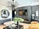 Chic living room with modern lighting, a large mirror, and unique decor at 4836 Se Merriman Se Walk # 23, Smyrna, GA 30080