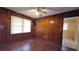 Charming bedroom with wood paneled walls, natural light, and neutral flooring at 340 Adelle Se St, Atlanta, GA 30315