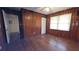 Inviting bedroom with wood paneled walls, hardwood floors and natural light at 340 Adelle Se St, Atlanta, GA 30315
