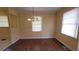 Traditional dining room featuring classic hardwood flooring, neutral walls, and a charming light fixture at 340 Adelle Se St, Atlanta, GA 30315
