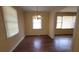 Dining room with wood floors, natural light, and a chandelier at 340 Adelle Se St, Atlanta, GA 30315