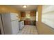 Efficient kitchen with gas range, classic cabinets, and easy-to-clean tile flooring at 340 Adelle Se St, Atlanta, GA 30315