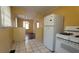 Functional kitchen design featuring a gas range and oven and white tile flooring at 340 Adelle Se St, Atlanta, GA 30315