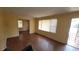 Comfortable living room with classic hardwood floors and ample sunlight streaming through the windows at 340 Adelle Se St, Atlanta, GA 30315