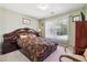 Bedroom with a large window providing natural light at 3560 Glen Summit Ln, Snellville, GA 30039
