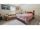 Cozy bedroom with a comfortable bed, loveseat, and a window for natural light at 3560 Glen Summit Ln, Snellville, GA 30039