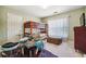 Bedroom with bunk beds, carpet flooring and window with wood blinds, and a blue drumset at 3560 Glen Summit Ln, Snellville, GA 30039