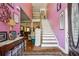 Inviting foyer with hardwood floors and an open staircase at 3560 Glen Summit Ln, Snellville, GA 30039