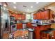 Well-appointed kitchen features stainless steel appliances and wood cabinets at 3560 Glen Summit Ln, Snellville, GA 30039
